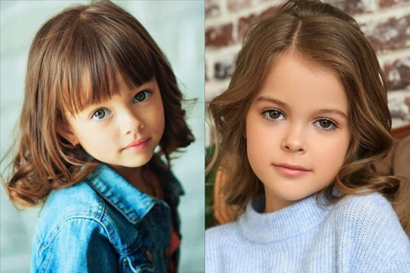 Bé gái 4 tuổi với mái tóc ngắn được trang trí nơ cài