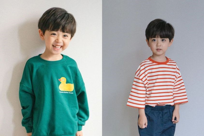 Bé trai với kiểu tóc mái ngố dễ thương, giúp làm ngắn và cân đối khuôn mặt dài.