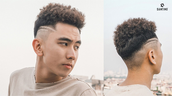 Chàng trai với kiểu tóc xoăn Afro độc đáo, một phong cách tóc nam đẹp năm 2024 ấn tượng