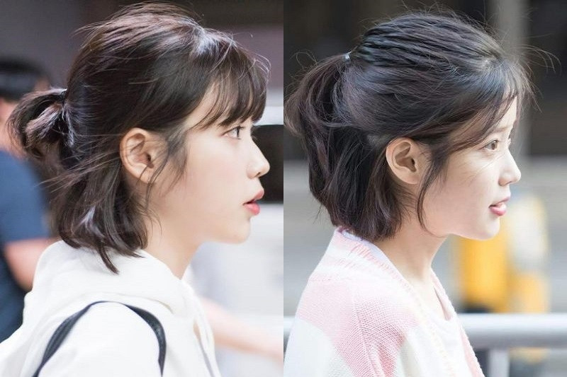 Cô gái Việt với áo dài xanh ngọc và kiểu tóc ngắn buộc nửa đầu thấp dịu dàng