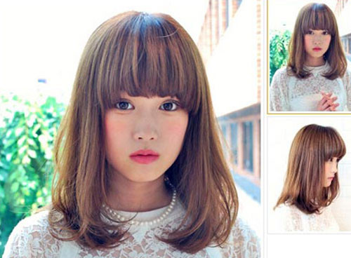 Cô gái với tóc ngang vai ép cụp phồng mái bằng trẻ trung