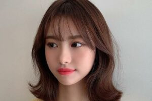 kiểu tóc lob uốn vểnh mềm mại, thích hợp cho cô nàng mặt tròn