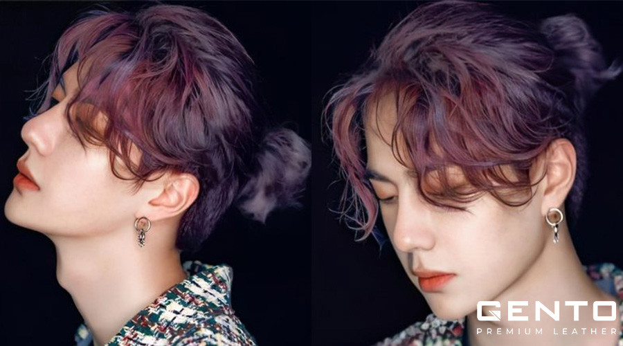 Kiểu tóc manbun nam xoăn tự nhiên, mang lại diện mạo mới mẻ và sáng tạo.