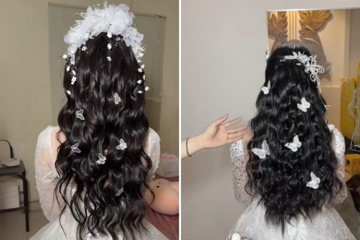 Kiểu tóc mây cô dâu xõa dài bồng bềnh với hoa cài nhẹ nhàng