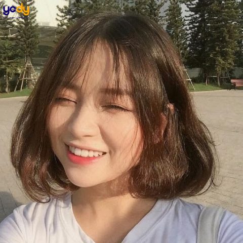 Kiểu tóc uốn đuôi cột cao cho mặt tròn