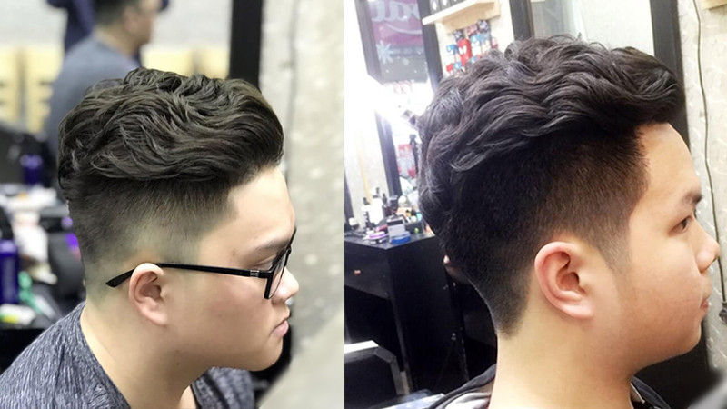 Kiểu tóc xoăn undercut cá tính, kết hợp cạo sát hai bên và uốn xoăn đỉnh đầu.