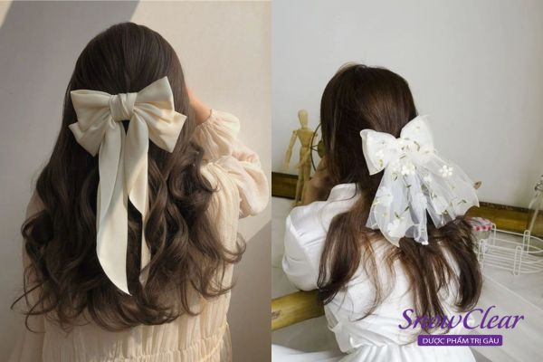 Sử dụng nơ cài tóc cỡ lớn để tạo điểm nhấn cho kiểu tóc công chúa, mang lại vẻ đẹp dịu dàng và thanh thoát
