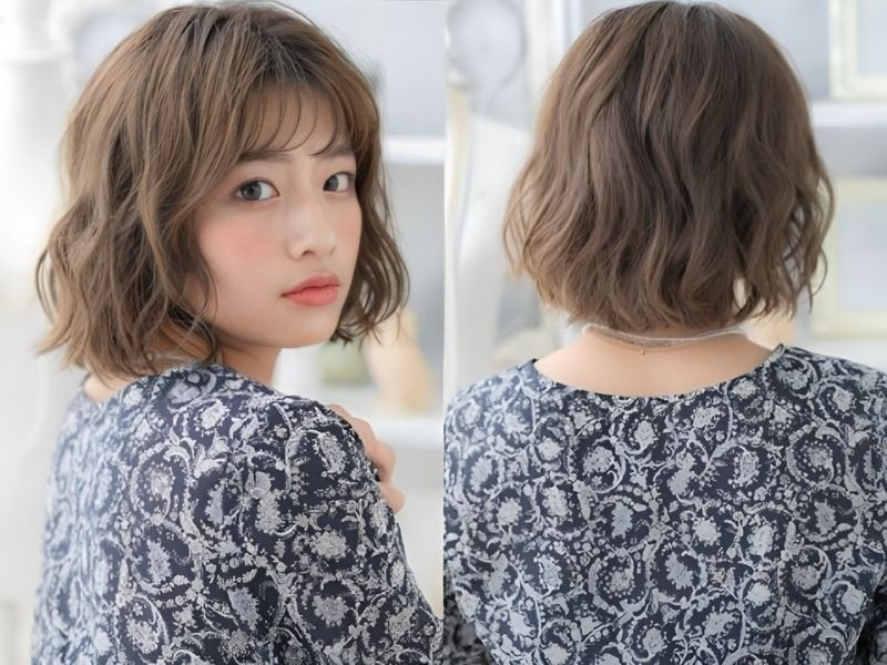 Tóc ngắn xoăn gợn sóng nhẹ nhàng, nữ tính, làm gương mặt thêm mềm mại