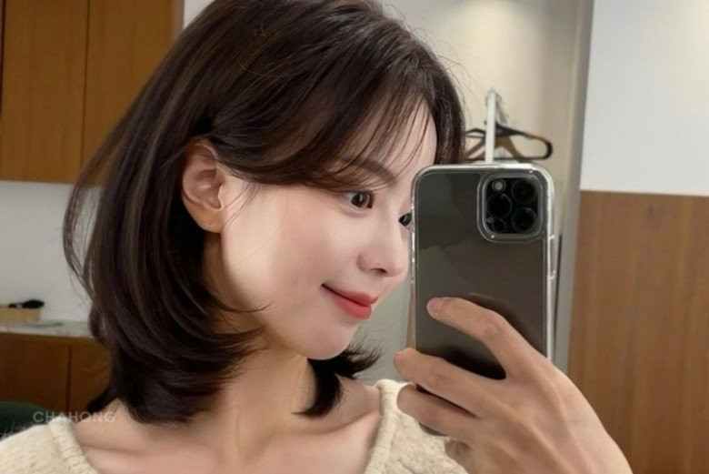 Tóc ngang xương đòn uốn cụp tạo nét duyên dáng