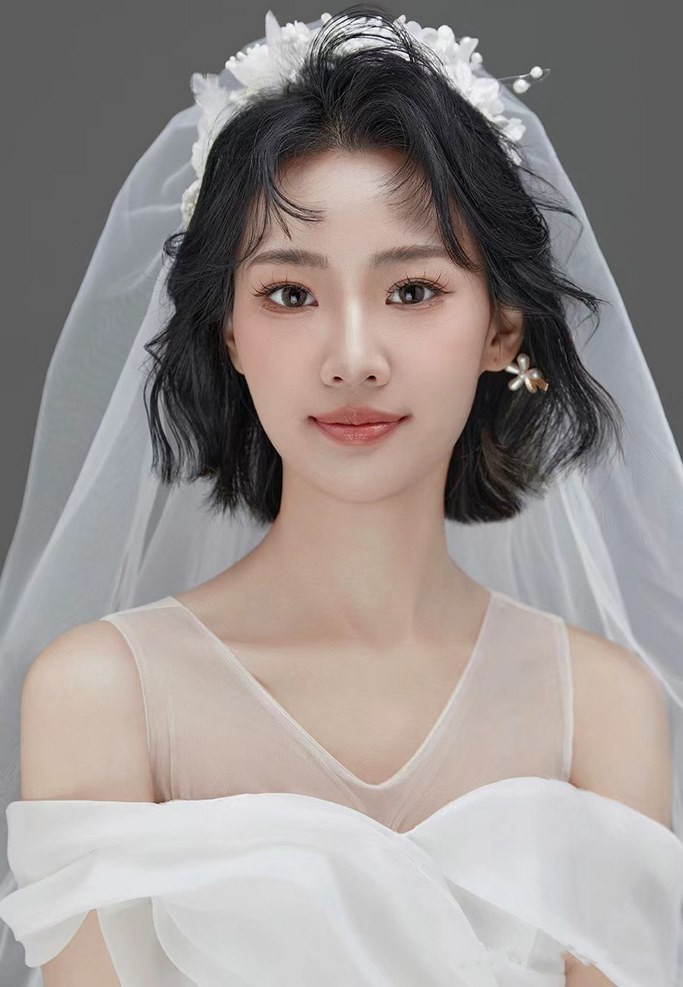 Ảnh cô dâu tóc ngắn ngang vai uốn cúp phồng hiện đại