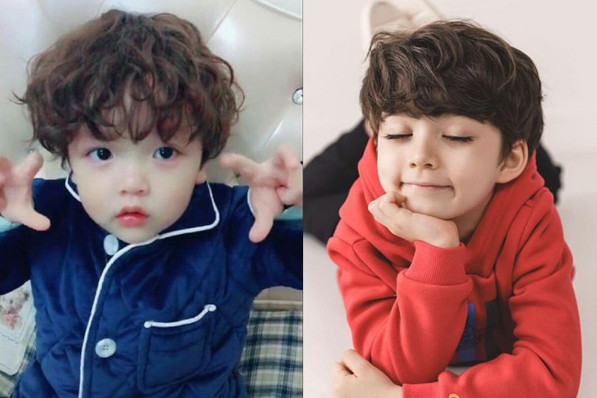 Bé trai 1 tuổi với kiểu tóc uốn xoăn nhẹ