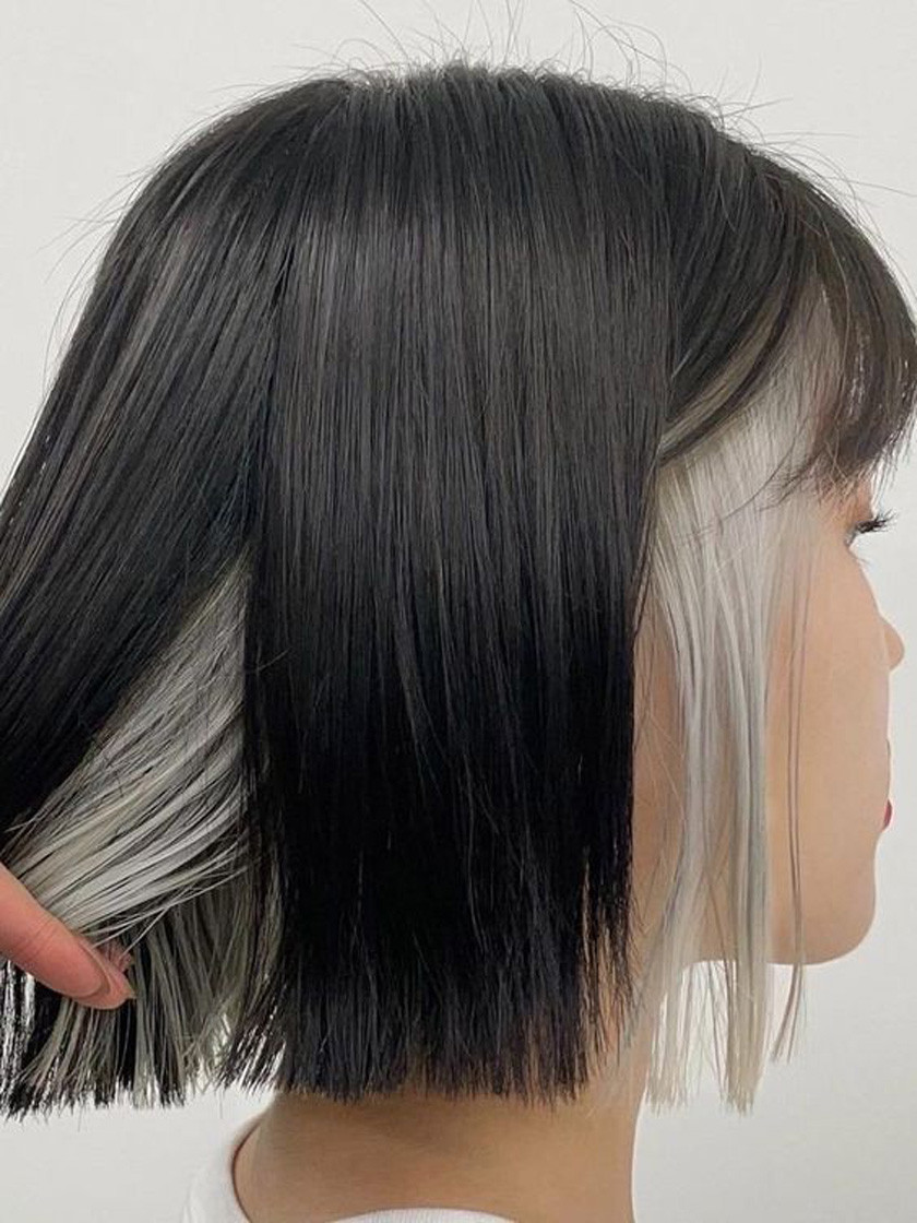 Kiểu tóc ngắn nhuộm ombre với sự chuyển màu từ nâu trầm sang nâu vàng ở đuôi tóc, tạo vẻ độc đáo và thời thượng cho mái tóc ngắn làm kiểu gì đi tiệc.