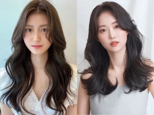 Mái bay nhẹ nhàng hòa quyện cùng layer dài, tạo sự mềm mại cho gương mặt tròn