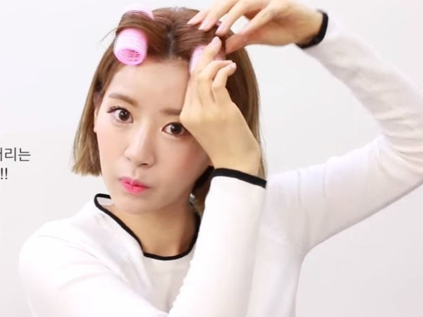 Mái tóc ngắn uốn phồng chân tự nhiên, thể hiện vẻ đẹp trẻ trung và bồng bềnh.