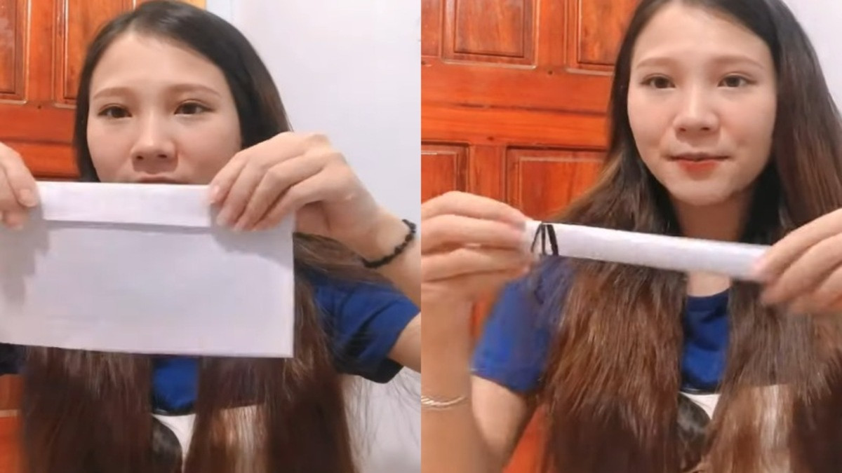 Người phụ nữ hướng dẫn **cách làm tóc xoăn tại nhà cho tóc ngắn** bằng cách cuốn tóc vào các dải giấy.