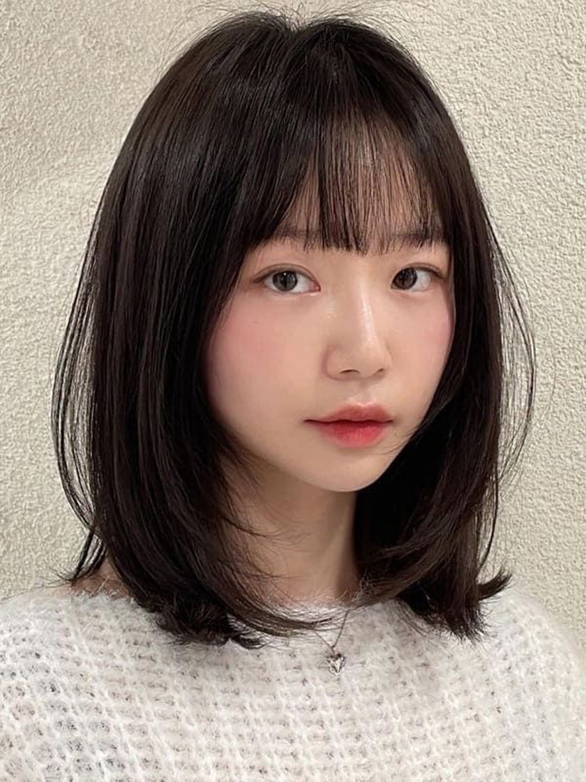 Tóc ngang vai uốn phồng cho người mập lùn